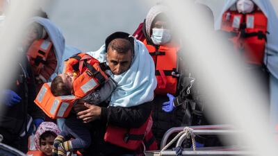 Migrants arrive in Dover on Tuesday. Getty Images