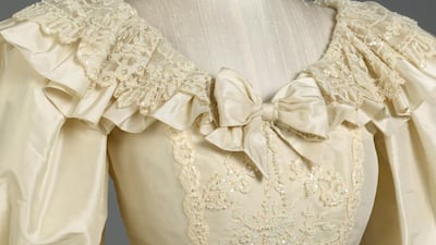 A detailed view of the neckline of the wedding dress. Royal Collection Trust