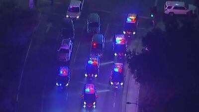 Police vehicles block a junction in the vicinity of a shooting in Thousand Oaks, California. KABC via AP