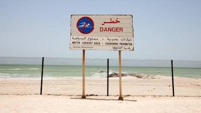 New barriers, such as in Al Rifah area near Ajman, prevent swimmers reaching the water after it was ruled too dangerous. Jaime Puebla / The National