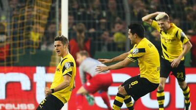 Borussia Dortmund's Sebastian Kehl, left, celebrates after netting the winner on Tuesday night in his side's 3-2 DFB-Pokal quarter-final victory over Hoffenheim. Friso Gentsch / EPA / April 7, 2015