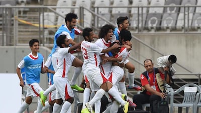 UAE players celebrate their second goal against Vietnam during their men's round of 16 football match of the 2014 Asian Games, at Hwaesong Sports Complex outside of Incheon, South Korea on September 26, 2014. AFP PHOTO / Ed Jones