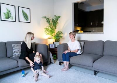 Claudine Gillard, right, of Sweet Dreams Consulting, consults Kelly Allison on methods to help her put her three-year-old son, Jack, to sleep. Photo: Reem Mohammed / The National