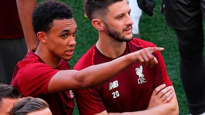 Jordan Henderson, Trent Alexander-Arnold, and Adam Lallana watch on. EPA