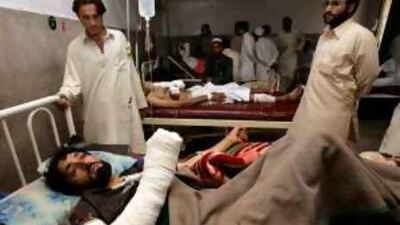 A victim of a suicide attack lies in a hospital bed in Peshawar yesterday.