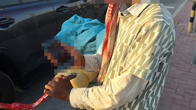 Police said the suspect arrested with Dh 20,000 in cash travelled across the city by bike to beg for money. Photo: Dubai Police
