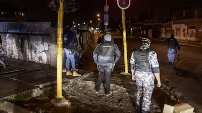 Undercover and uniformed Saps members and security officers brace themselves, as violence and looting continued after a weekend of disorder involving pro-Zuma protesters.