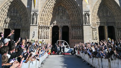 Pope Leo arrives at Notre-Dame Cathedral in the popemobile. AFP