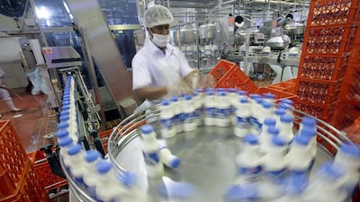 Milk rolls off Al Ain Dairy’s assembly line in Al Ain. The company will open a new facility by 2017 to supply a rise in local demand. Sammy Dallal / The National