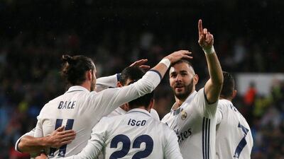 Real Madrid’s Karim Benzema celebrates his goal with teammates. Andrea Comas / Reuters