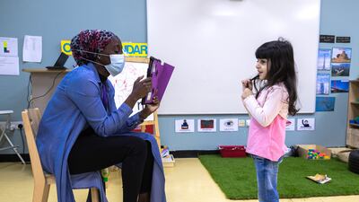 A teacher and pupil at American Academy for Girls. Teachers have had to adapt quickly to a new way of doing things, say staff.