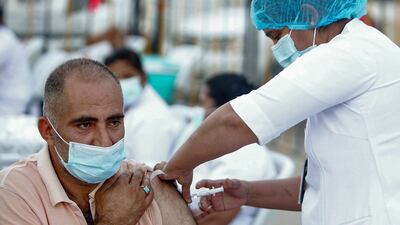 A man receives his Covid-19 vaccine during a mass vaccination campaign in the Bneid Al Gar district of Kuwait. All photos: Yasser Al-Zayyat / AFP