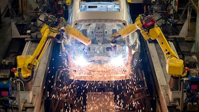 Robots weld vehicle panels at the Nissan Sunderland Plant in North East England. Forecasting the effect of automation on the global workforce is difficult. Oli Scarff/AFP
