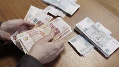 A businessman counts Russian rouble banknotes. REUTERS/Eduard Korniyenko