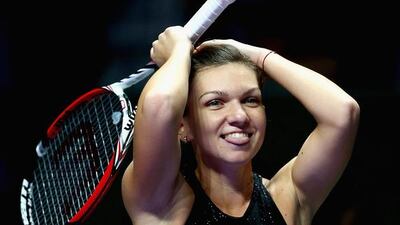 Simona Halep reacts after beating Serena Williams in their match at the WTA Finals on Wednesday in Singapore. Clive Brunskill / Getty Images / October 23, 2014