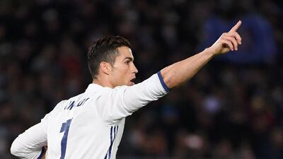 Real Madrid’s Cristiano Ronaldo celebrates scoring a penalty for 2-2. Toshifumi Kitamura / AFP