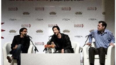 From left, the director of Wrecked, Michael Greenspan, the movie's star, Adrien Brody, and the producer Kyle Mann discuss their new film to a thrilled audience at Abu Dhabi Film Festival.