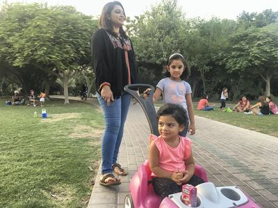 Nilofer Hashim takes her two daughters Zara and Zoya to the park. Antonie Robertson / The National