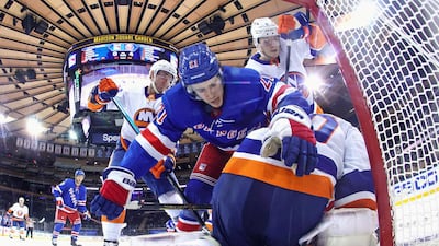 Brett Howden, of the New York Rangers, tumbles over New York Islanders' Semyon Varlamov at Madison Square Garden on Thursday, April 29. The Islanders won the NHL match 4-0. Reuters