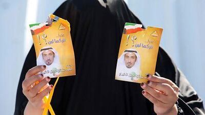 A female Kuwaiti votes in elections on Saturday. The poll was largely boycotted by the opposition.