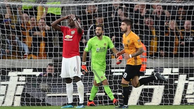Pogba reacts to his spot-kick miss. AP Photo