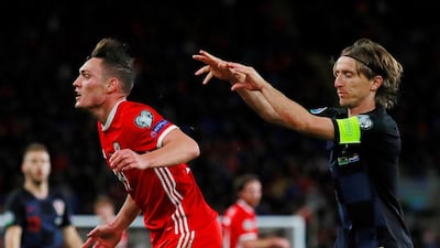 Wales' Connor Roberts and Croatia's Luka Modric clash. Reuters