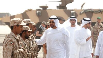 Sheikh Mohammed Bin Zayed greets members of the UAE's armed forces during a war games training exercise. (Lee Hoagland / The National)