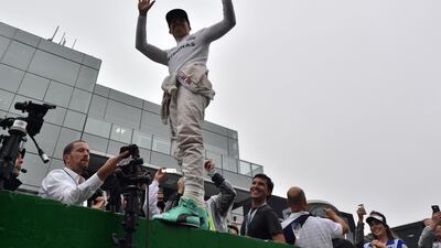Nico Rosberg celebrates taking second place in the Brazilian Grand Prix. Nelson Almeida / AFP