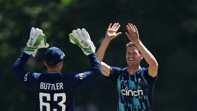 England bowler David Payne celebrates taking the wicket of Scott Edwards. Getty
