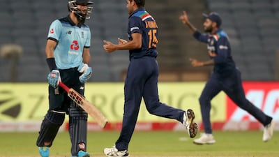 India's Bhuvneshwar Kumar, center, celebrates the dismissal of England's Moeen Ali. AP