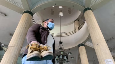 A man wearing a protective mask at the Al Rahman mosque. Reuters