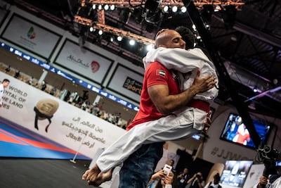 Hamad Eissa Al Balooshi is congratulated by coach Ibrahim Al Hosani after winning para jiu-jitsu gold in the JJIF World Championship. Courtesy UAEJJF