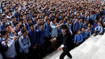 Karim Asir performs at a school in Kabul. Reuters