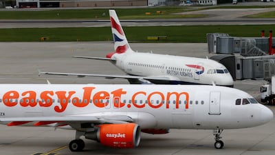 FILE PHOTO: A British Airways and an Easyjet aircrafts are pictured at Cointrin airport in Geneva, Switzerland, April 13, 2016. Picture taken through a window. REUTERS / Denis Balibouse / File Photo