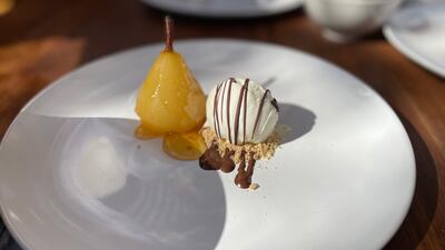 Poached pear with orange marmalade glaze and ice cream. Janice Rodrigues / The National