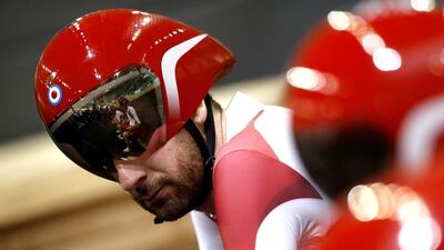 England's Bradley Wiggins prepares to leads his teammates Andy Tennant, Ed Clancy and Steven Burke to compete in the men's 4000m team pursuit final race in the Sir Chris Hoy Velodrome during the 2014 Commonwealth Games in Glasgow, Scotland on July 24, 2014. Australia won the gold medal, England the silver and New Zealand the bronze. AFP PHOTO/ADRIAN DENNIS