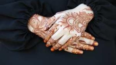 Emirati woman traditionally use henna patterns to decorate their hands and arms for family celebrations such as weddings.