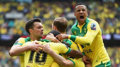 Cameron Jerome of Norwich City (10) is congratulated by Martin Olsson (23) and team mates as he scores their first goal during the Sky Bet Championship Playoff Final between Middlesbrough and Norwich City at Wembley Stadium on May 25, 2015 in London, England. (Photo by Tom Dulat/Getty Images)