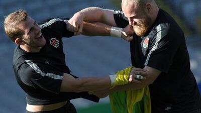 England’s Tom Croft, left, wrestles with Dan Cole during a training session.