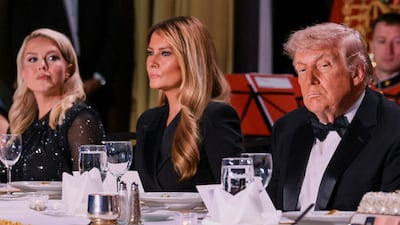 U. S. President Donald Trump and first lady Melania Trump, next to White House Press Secretary Karoline Leavitt, attend the annual White House Correspondents' Association dinner in Washington, D. C. , U. S. , April 25, 2026. REUTERS / Jonathan Ernst