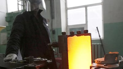 A worker works on an ingot of 99.98 per cent pure platinum at the Krastsvetmet non-ferrous metals plant in Siberia. Krastsvetmet plans to launch a new refinery complex at its Siberian base. Ilya Naymushin / Reuters