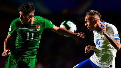 Bolivia's Leonardo Vaca, left, and Brazil's Everton Soares vie for the ball. AFP
