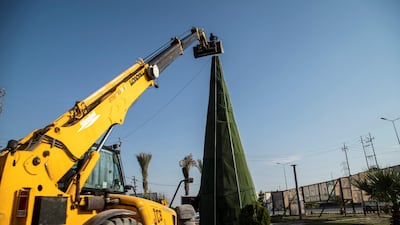 Setting up a Christmas tree outside the town of Hamdaniya, Mosul. Haider Husseini / The National