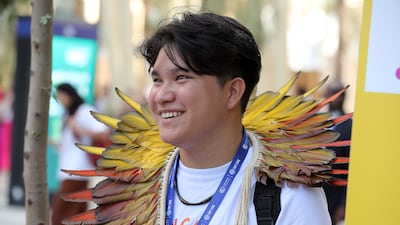 A delegate at the first day of Cop28 at Expo City Dubai. Pawan Singh / The National