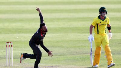 Imran Haider of the UAE bowls in the match.