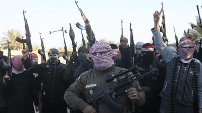 Masked Sunni gunmen chant slogans during a protest against Iraq's government in Fallujah on January 7. Reuters