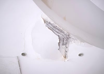 Water leaks from the ceiling of the reception of MR Tower. Residents are eager for maintenance of the building to be improved. Reem Mohammed/The National