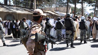 epa08414986 Afghans shout slogans outside the Iranian consulate during a protest against the Iranian regime and demand justice for the Afghans allegedly killed by the Iranian security forces, in Herat, Afghanistan, on May 11, 2020. EPA