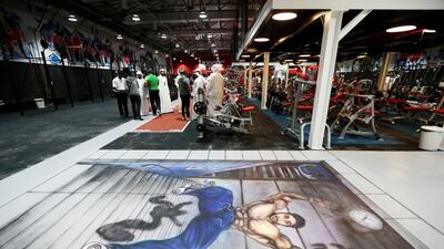 A warehouse workout space, MProve Fitness covers 15,000 square feet and will soon include a cafe and barber’s shop. Christopher Pike / The National