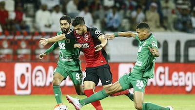 Al Ahli, in red, played in their first game since their 1-0 defeat in the second leg of the Asian Champions League final at Guangzhou last week. Hasan Alraesi / Al Ittihad